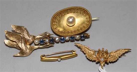 A 14ct gold flying Swans brooch, a 14ct gold seed pearl and sapphire brooch and three other gold brooches.